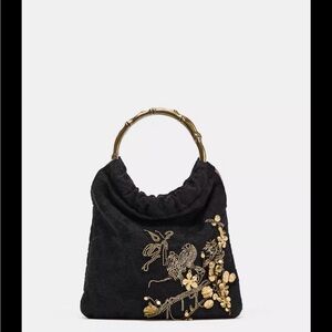 Embroidered mini bucket bag